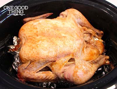 A rotisserie chicken in a crock pot, requiring foil.