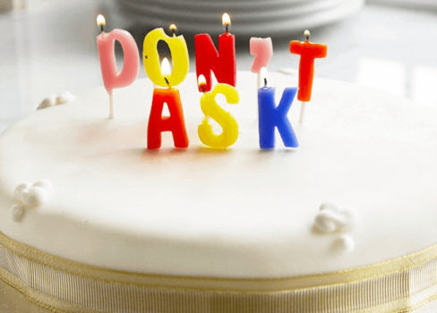 A cake with candles that say don't ask, perfect for turning 50.