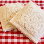 A homemade red and white checkered tablecloth.