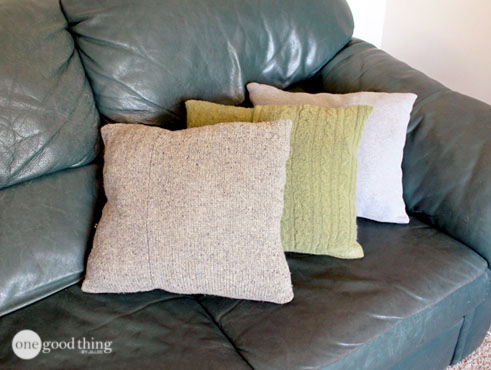 Finished sweater pillows on a couch
