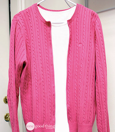 A thrifted crew neck sweater before being turned into a cardigan