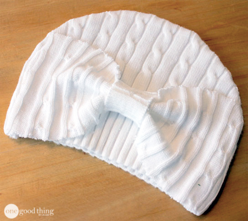 A baby hat sewn from the ribbed bottom of an old sweater