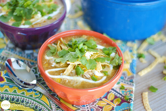 Two hearty bowls of white bean chicken chili on a table.