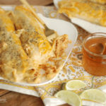 Honey Lime Chicken Enchiladas on a plate.