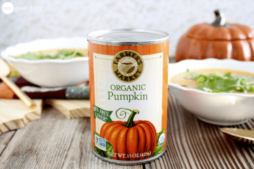 A can of organic pumpkin soup on a wooden table.