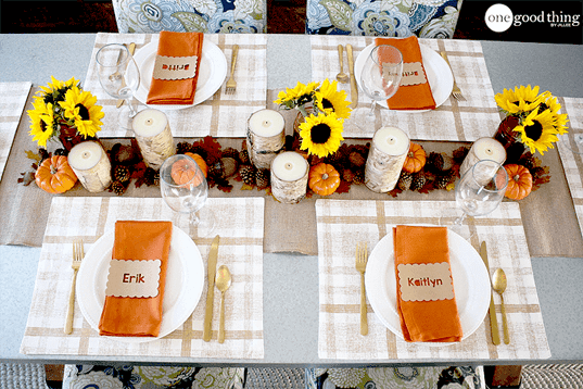 A plaid tablecloth with sunflowers, perfect for Thanksgiving preparation.