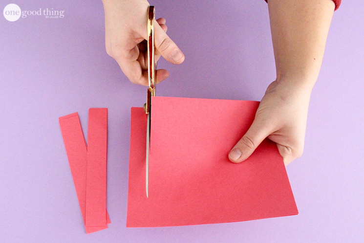 Cutting red cardstock into 1-inch strips