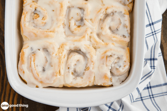 Cinnamon rolls in a white dish.