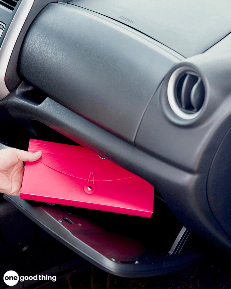 putting an paper organizer into a glove compartment 