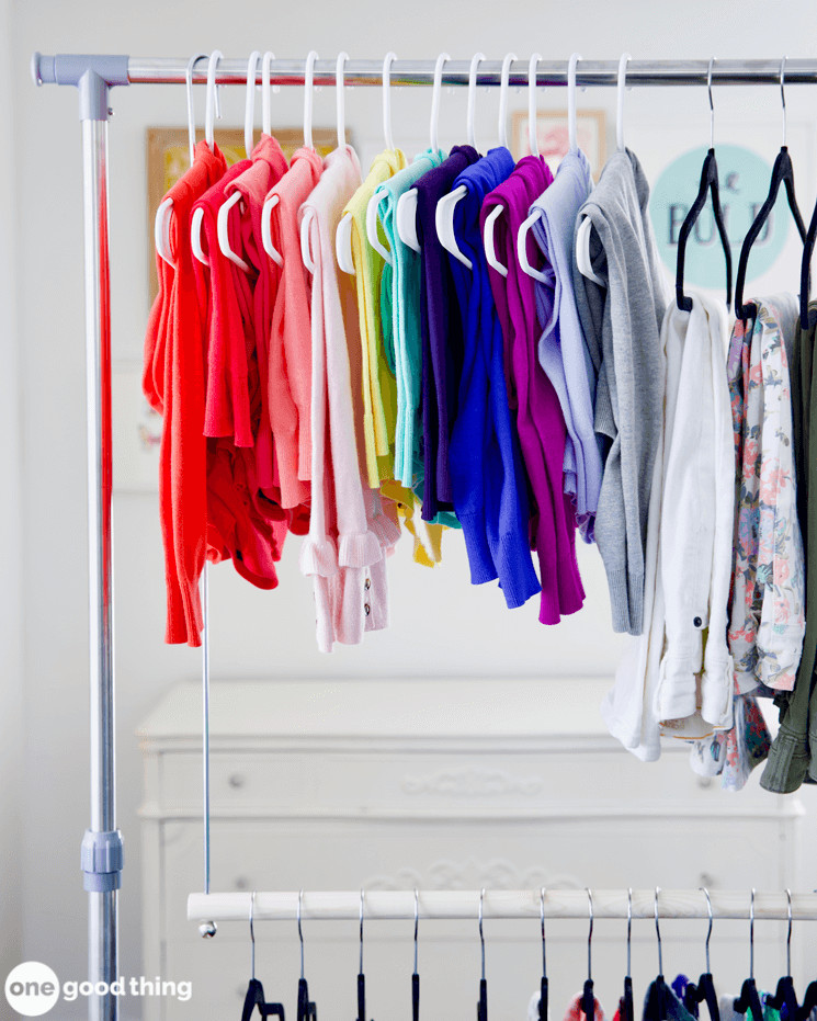 clothes hanging on a portable clothing rack