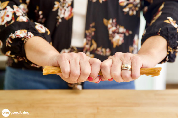 Breaking spaghetti in half