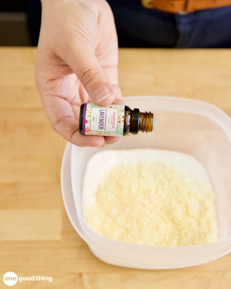 DIY Car Upholstery Cleaner DIY Car Upholstery Cleaner - putting a drop of lavender essential oil into a bowl of grated fels naptha soap and borax