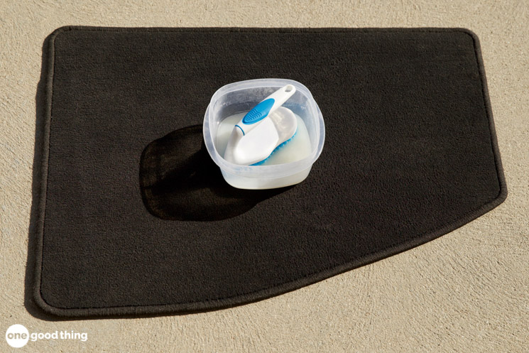 DIY Car Upholstery Cleaner DIY Car Upholstery Cleaner - car floor mat with bowl of cleaning solution and a scrub brush