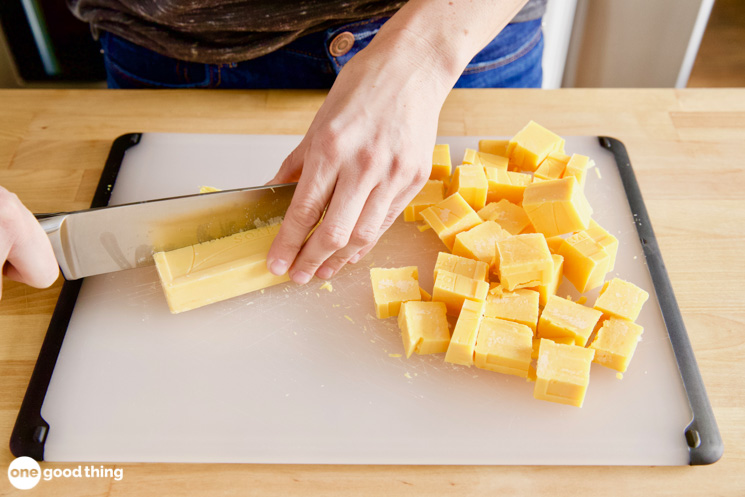 The Fels-Naptha soap needs to be in very fine pieces for homemade laundry detergent, so start by cutting the bars into small cubes.