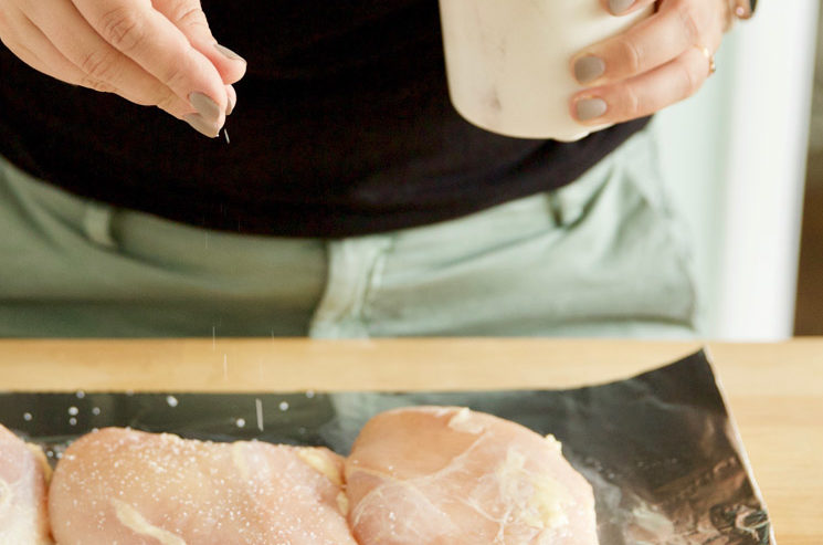 Season the chicken breasts with salt and pepper before cooking.