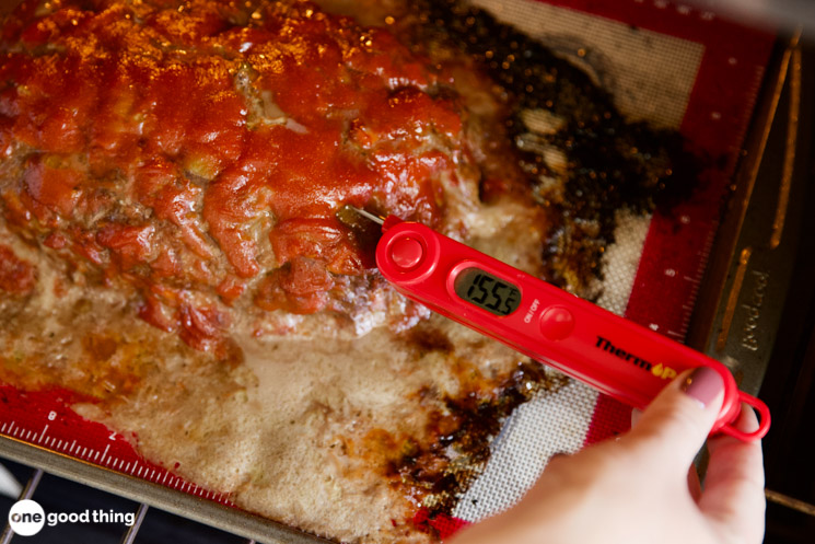 checking meatloaf temperature with an instant read thermometer