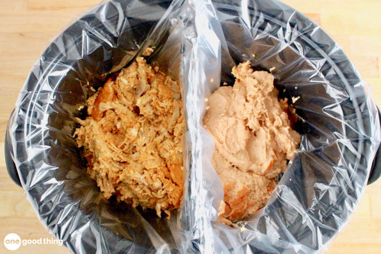 crockpot with a foil divider down the middle holding dip and chicken