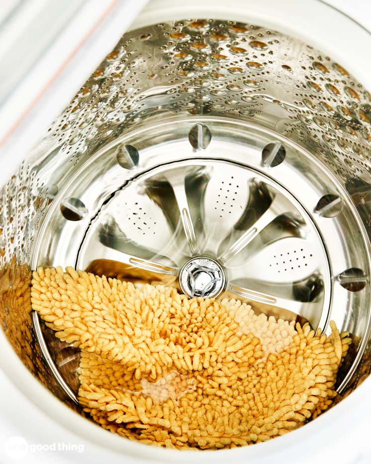 HE Washer Small Load Trick - washer looking unbalanced with just a rug in it.