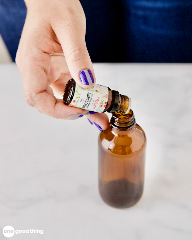 DIY Toilet Odor Spray - putting essential oil into spray bottle