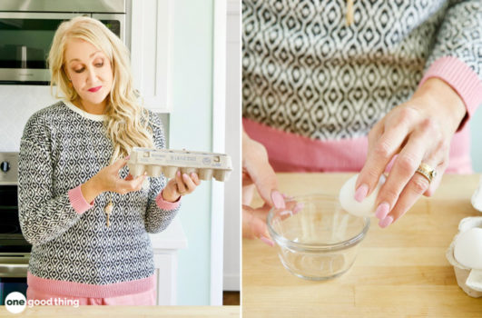 woman looking at egg carton codes and cracking an egg into a bowl