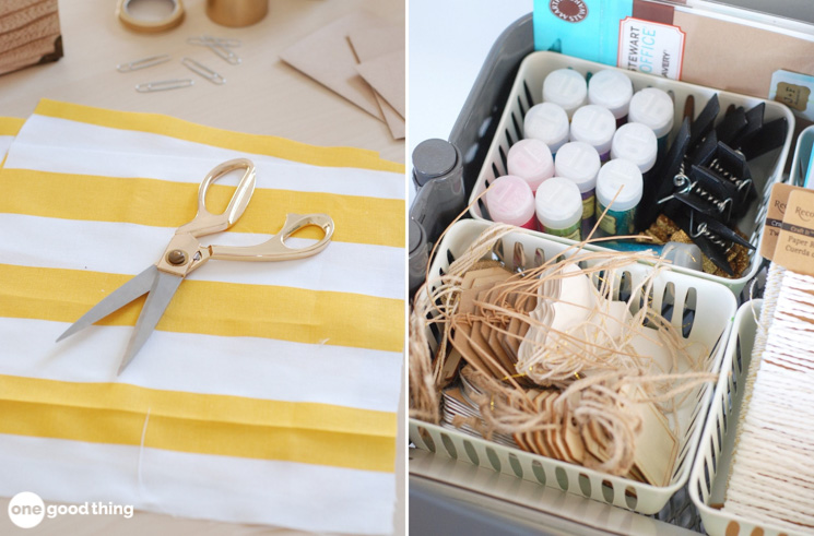 scissors on a sheet of yellow and white striped paper/crafting supplies in bins