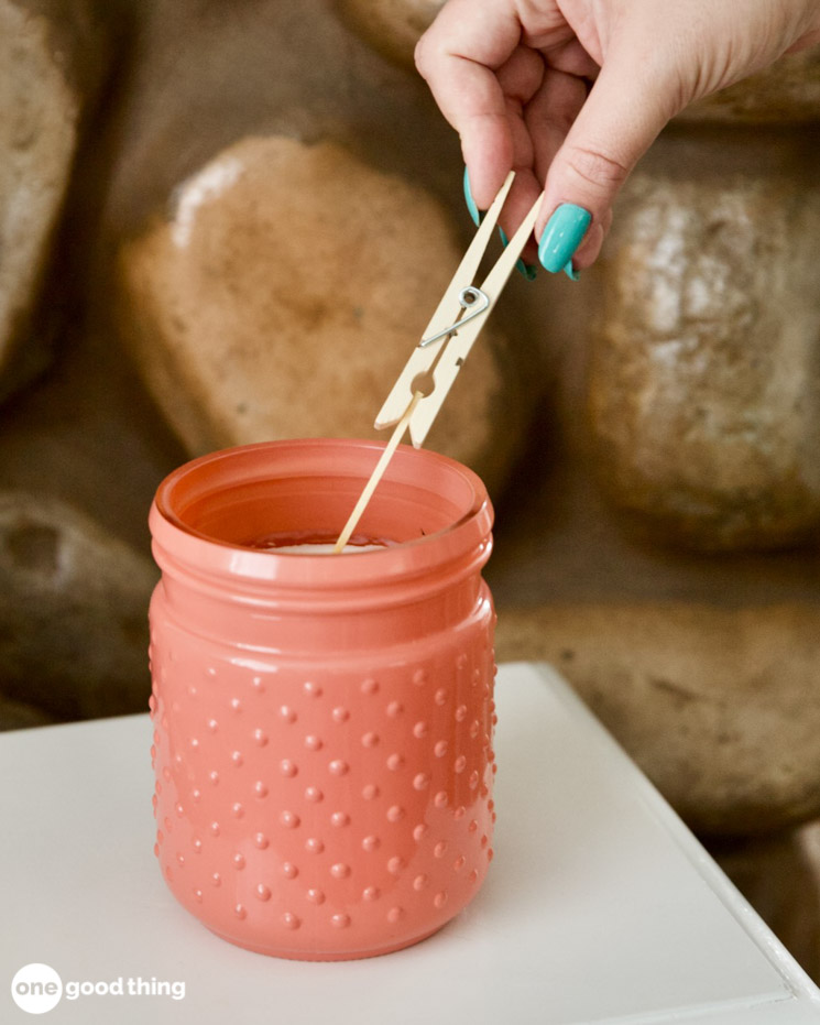 uses for clothespins - holding a match to get to a candle in a jar