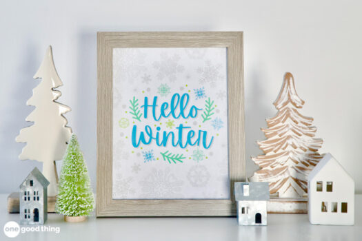 Free printable sign in a frame that says, "Hello Winter" with snowflakes around the text