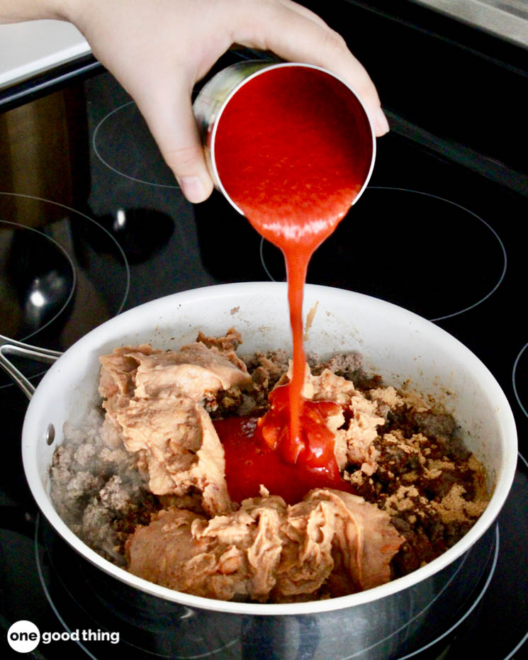 Brown the hamburger and add the taco seasoning, beans, and tomato sauce.