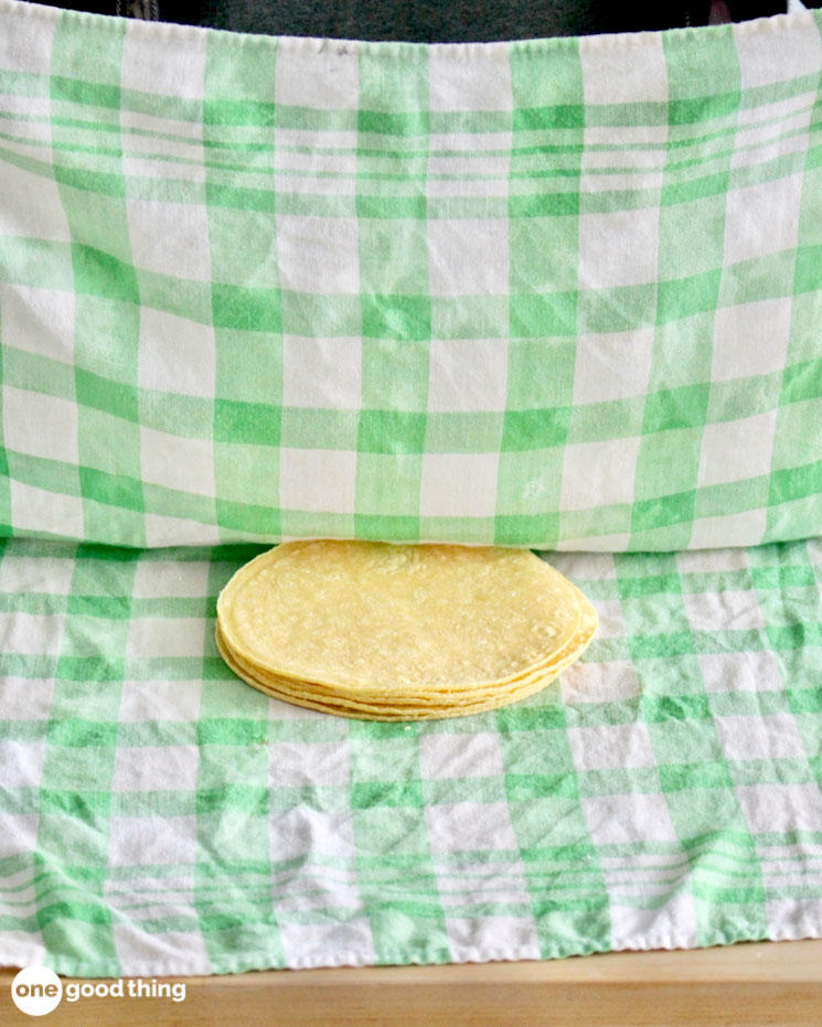 Soften the corn tortillas by wrapping in a damp napkin and microwave briefly.