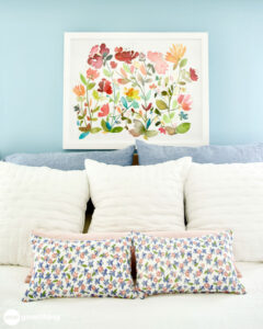 make the bed Made a bed with lots of pillows
