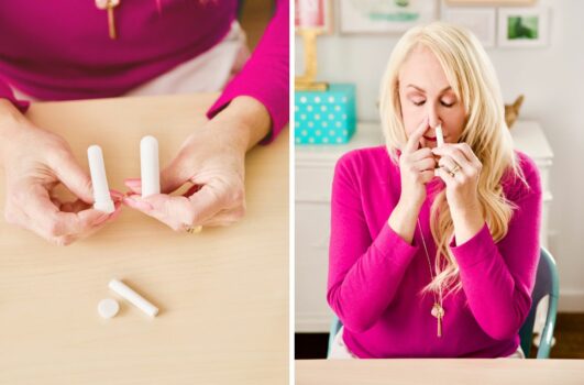 woman using a diy nasal inhaler with essential oils