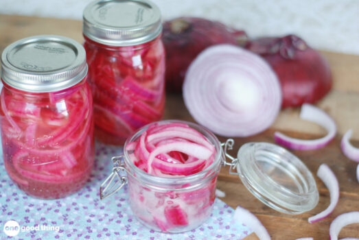 Pickled Onions - jars of pickled onions surrounded by red onions