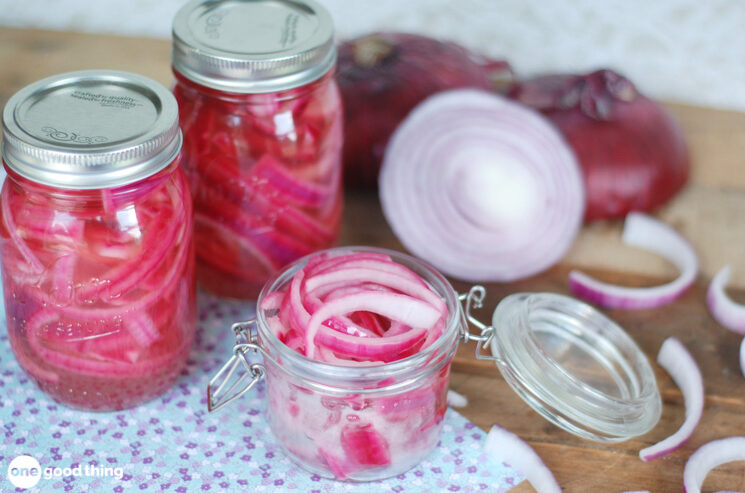 Pickled Onions - jars of pickled onions surrounded by red onions