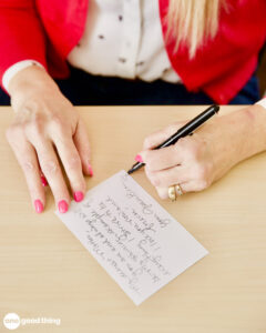 What Moms Really Want What Moms Really Want - Close up of a woman's hand as she handwrites a note
