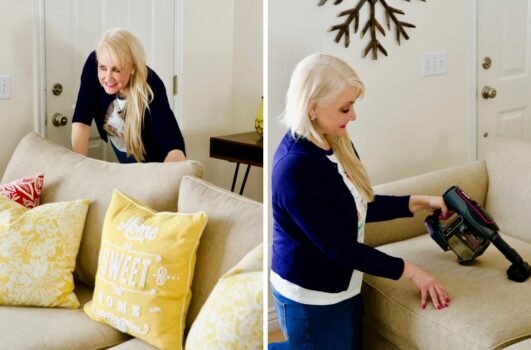 ruining your sofa - woman behind a sofa; woman vacuuming sofa cushion