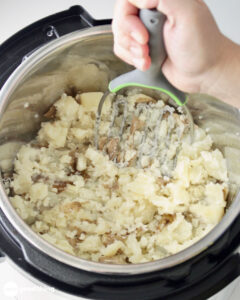 Mashing your instant pot mashed potatoes by hand avoid gummy mashed potatoes.