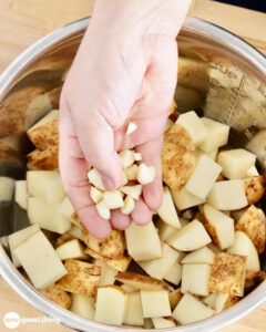 No need to peel for instant pot mashed potatoes - just pop them in the pot with the broth and garlic.