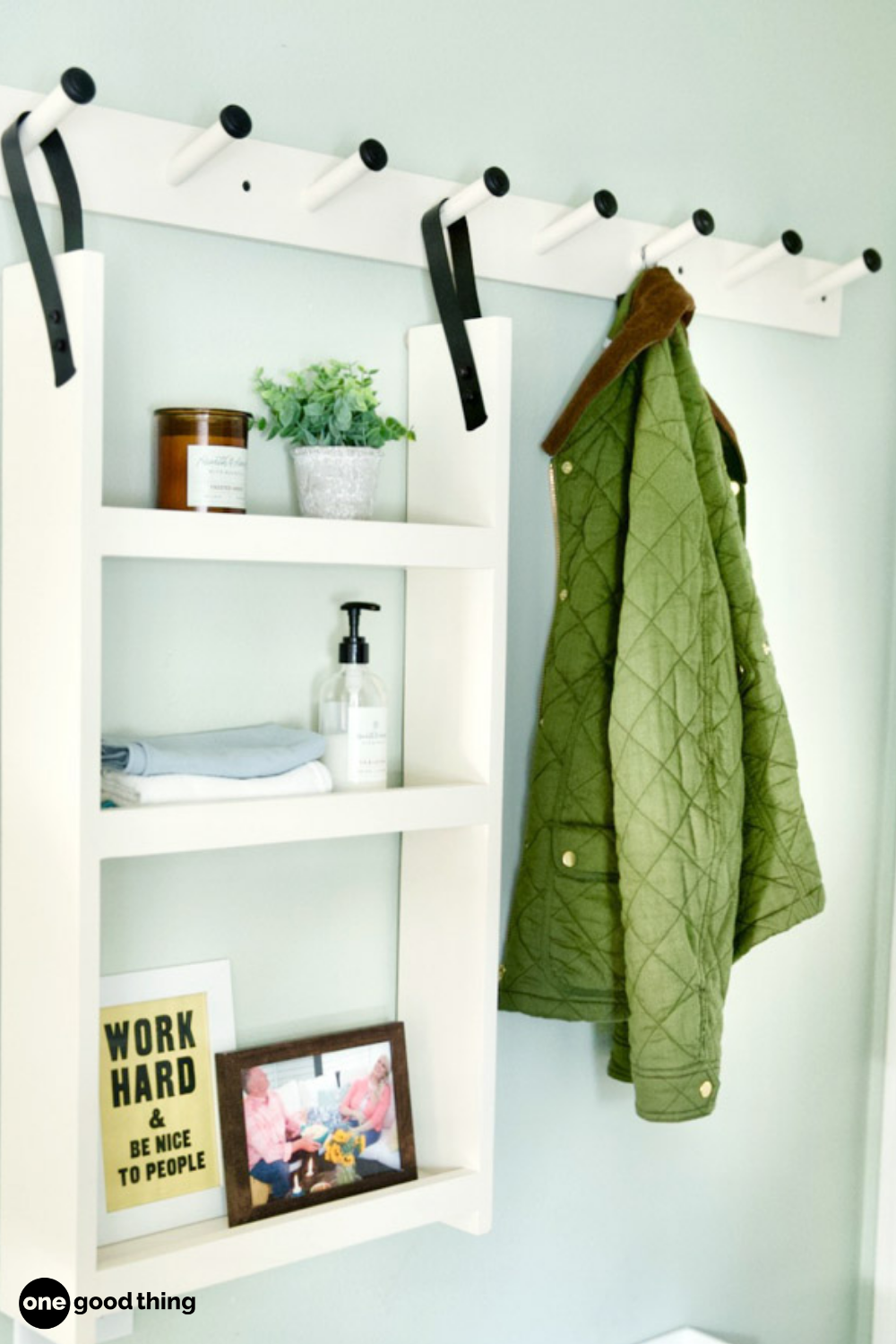 A bathroom with a coat rack and coat hooks that helps prevent misplaced items.