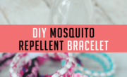 DIY mosquito repellent bracelet with three colorful braided bracelets and a spray bottle on a wooden surface.