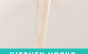 Discover the magic of kitchen hacks with this wooden spoon, cleverly equipped with rubber bands across the top of a sleek white pot.