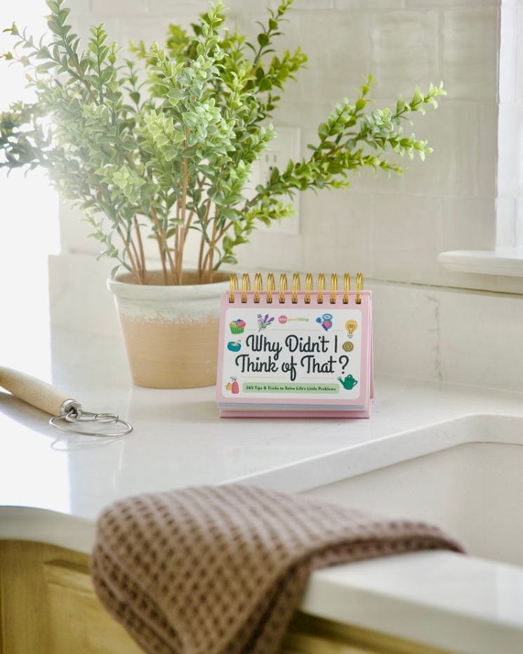 A spiral-bound calendar with the phrase 