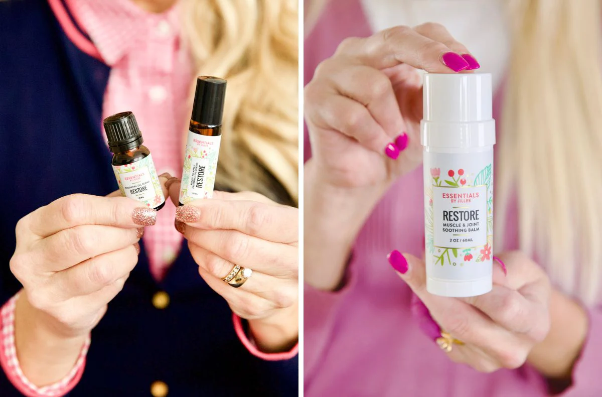 A person holds two small bottles labeled 