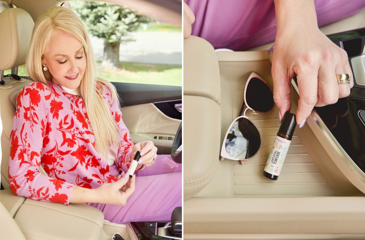 soothe aches and pains_4 Woman sitting in a car applying essential oil to ease everyday aches; close-up of her hand placing an oil bottle next to sunglasses on the car’s console.